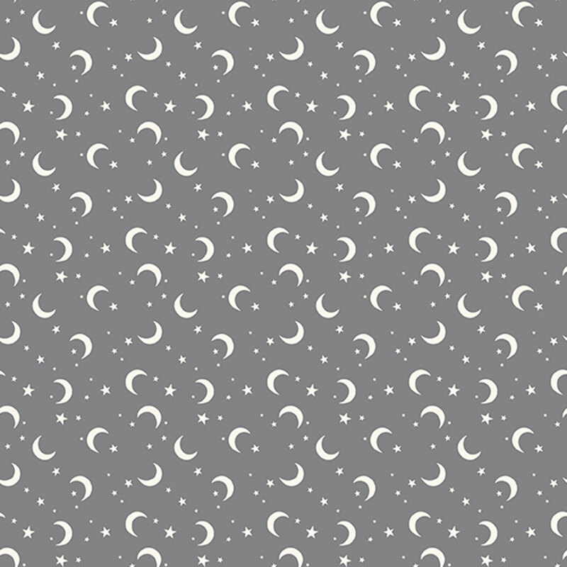 This gray fabric features scattered crescent moons and stars.
