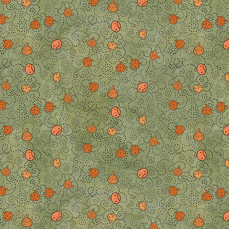 mottled sage green fabric featuring orange pumpkin faces tossed with black dotted swirls.