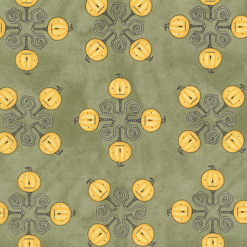 mottled sage green fabric featuring a geometric design topped with orange pumpkin heads.