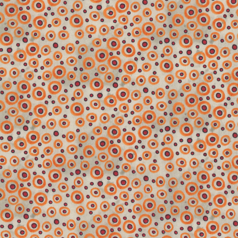 mottled light gray fabric scattered with orange dots with black outlines and circles in various sizes.