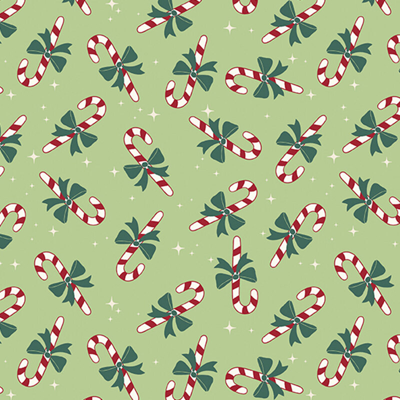 A light green fabric with tossed candy canes and white sparkles.  