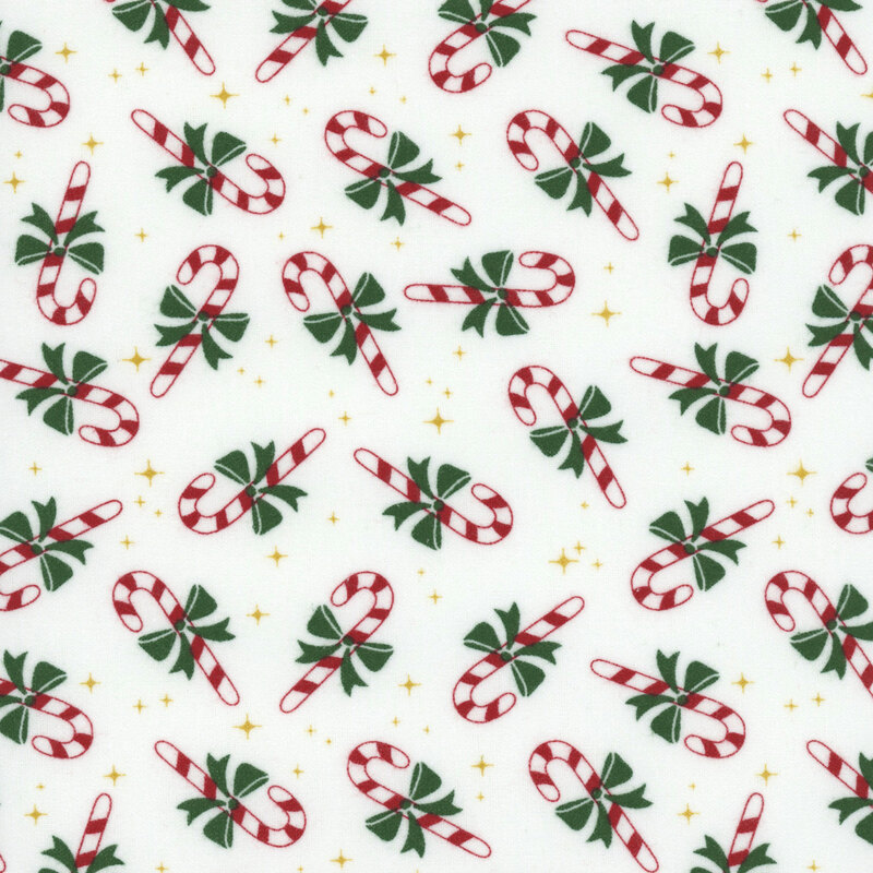 A white fabric with tossed candy canes and gold sparkles.  