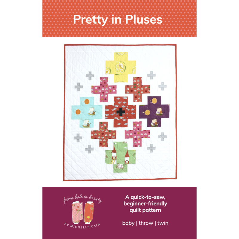 The front of the Pretty in Pluses Quilt Pattern, showing the finished quilt isolated on a white background.