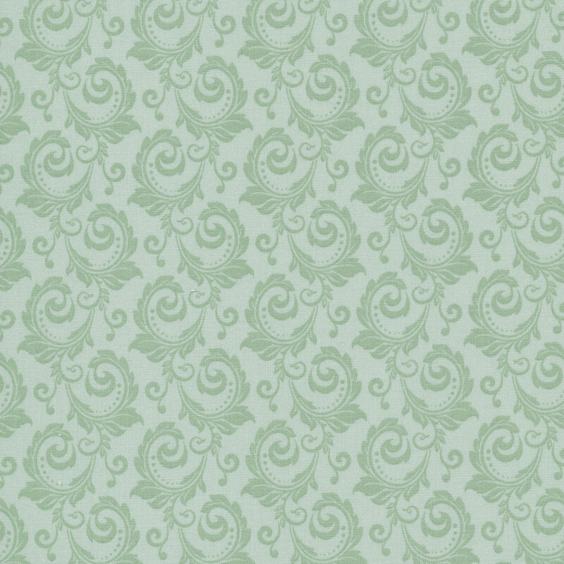 Tonal sage green fabric with a swirl pattern.
