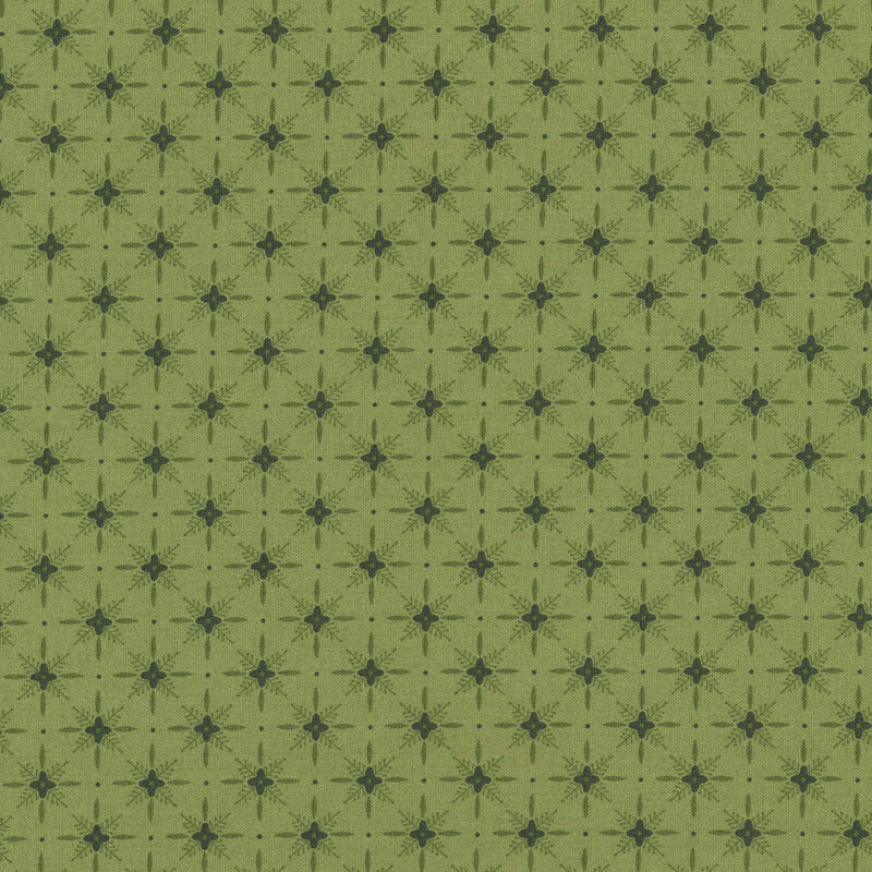Sage green fabric with a dark pattern of geometric shapes in a lattice with florals. 