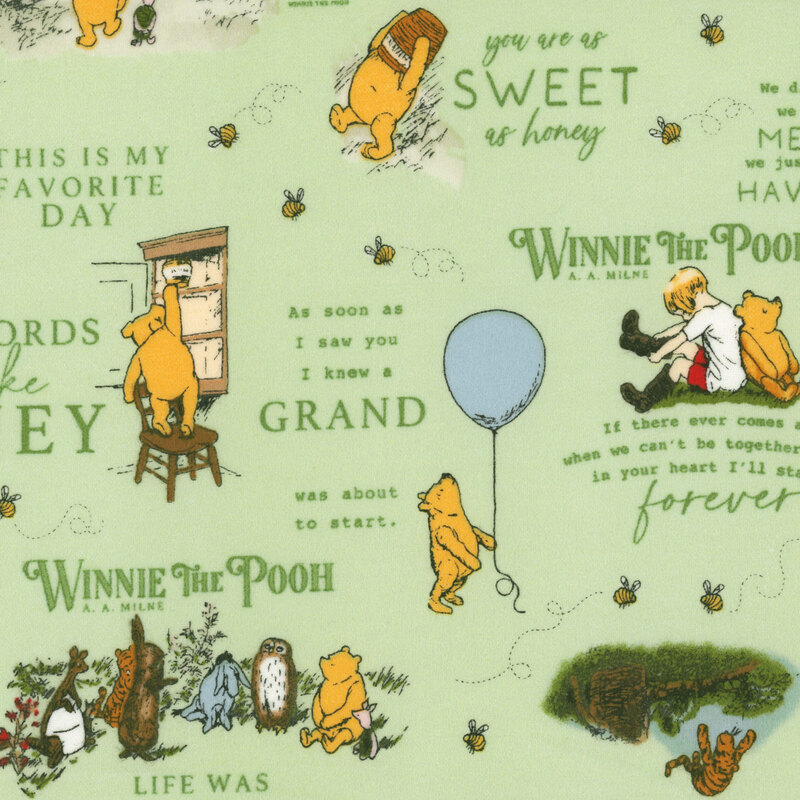 pale green flannel fabric featuring scenes and words from the Winnie the Pooh.