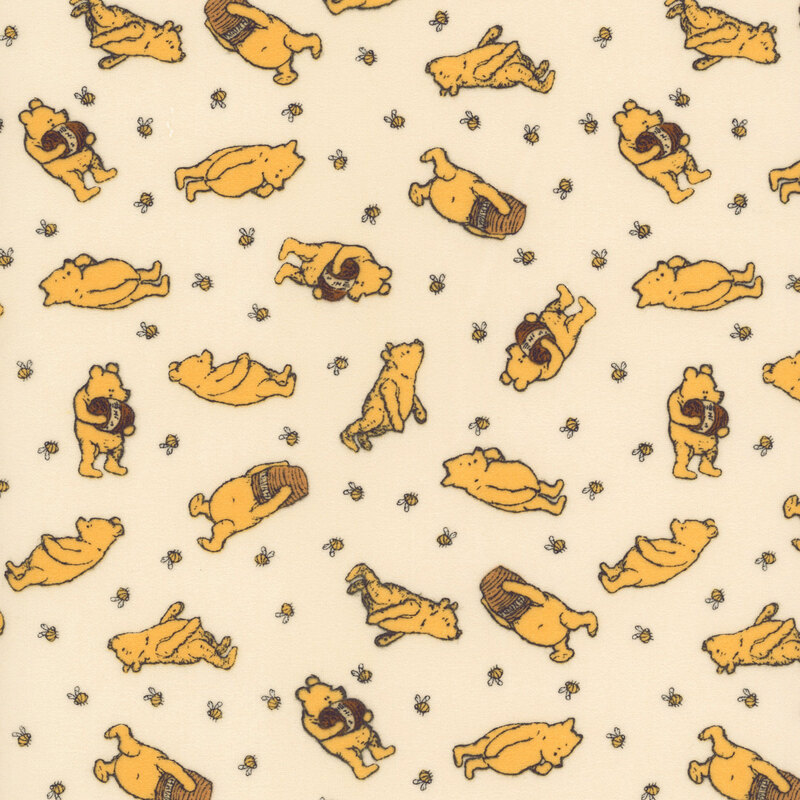cream flannel fabric tossed with Winnie the Pooh with a jar of honey surrounded by bees.