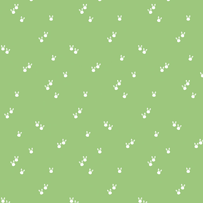 small white bunny heads tossed on a tea green background