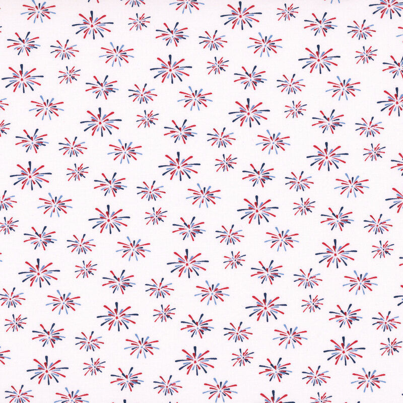snow white fabric tossed with bursts of red and blue fireworks