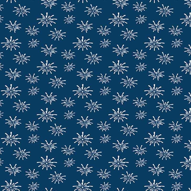 denim blue fabric tossed with bursts of white fireworks