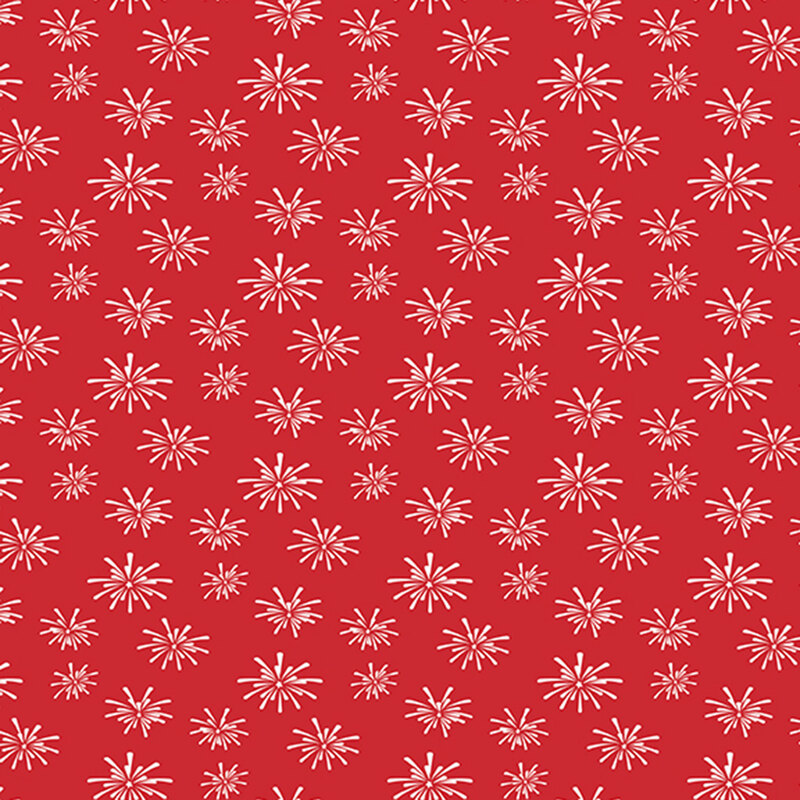 cherry red fabric tossed with bursts of white fireworks