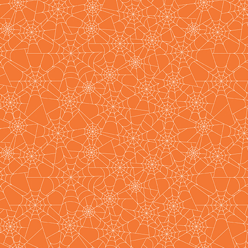 pumpkin orange fabric covered in white spider webs