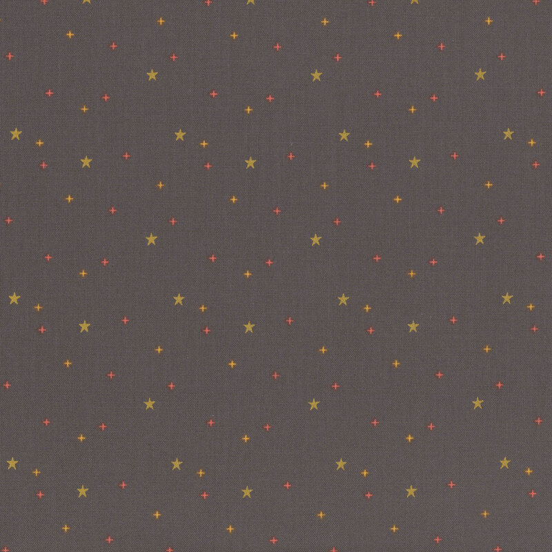 gold stars scattered with gold and orange crosses on warm black fabric