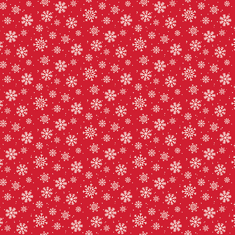 white snowflakes in various sizes scattered on cherry red fabric
