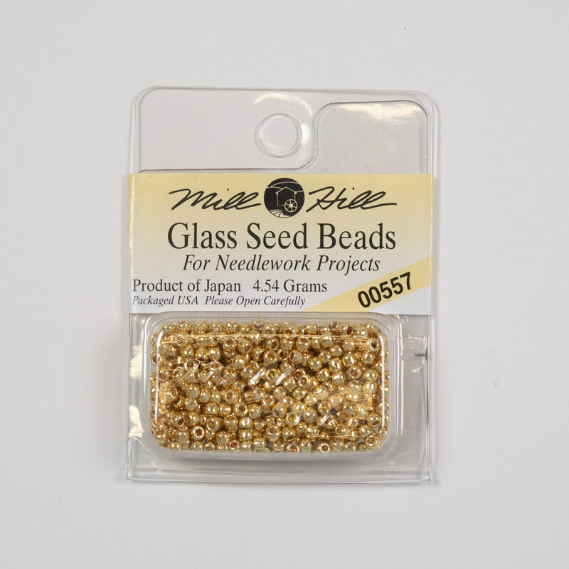 A package of Mill Hill Glass Seed Beads in the color old gold. 