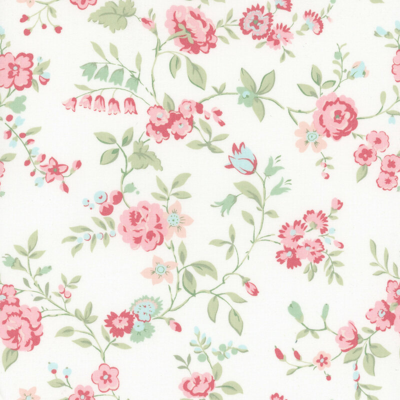 White fabric with a pattern of large pink and blue florals alongside green leaves.