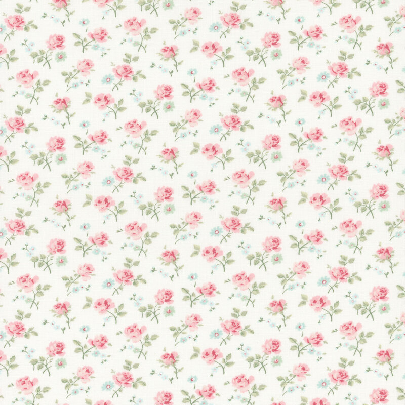 white fabric with a dense pattern of tossed pink roses and assorted florals.