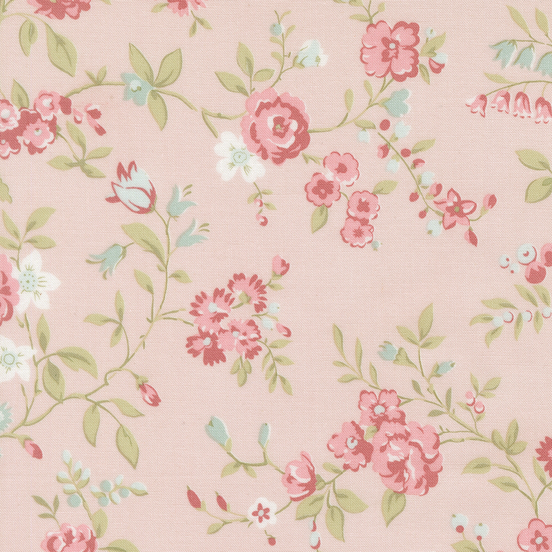 Pink fabric with a pattern of large salmon and blue florals alongside green leaves.