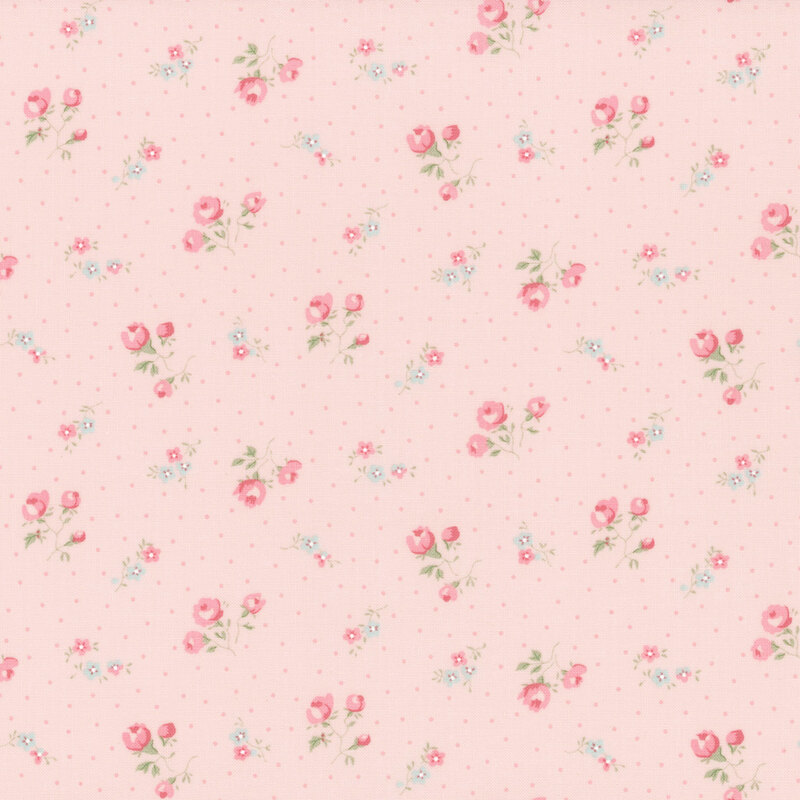 Pink fabric with a pattern of pindots and clusters of roses. 