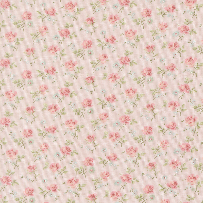 This pink fabric features a dense pattern of tossed roses and assorted florals.