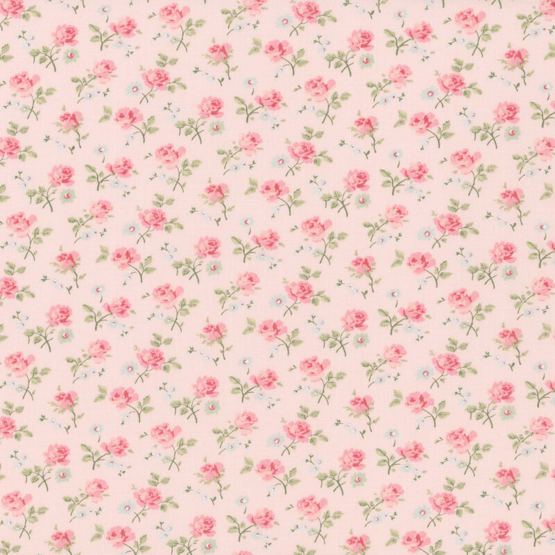 This pink fabric features a dense pattern of tossed roses and assorted florals.