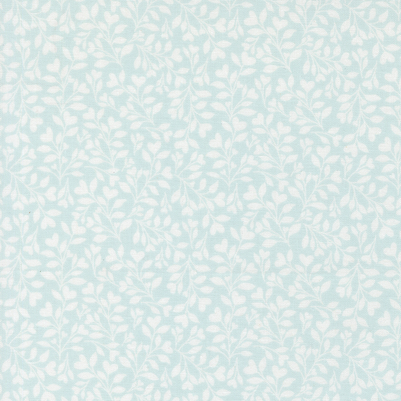 light blue fabric with a dense pattern of white leaves and vines accented with subtle hearts.