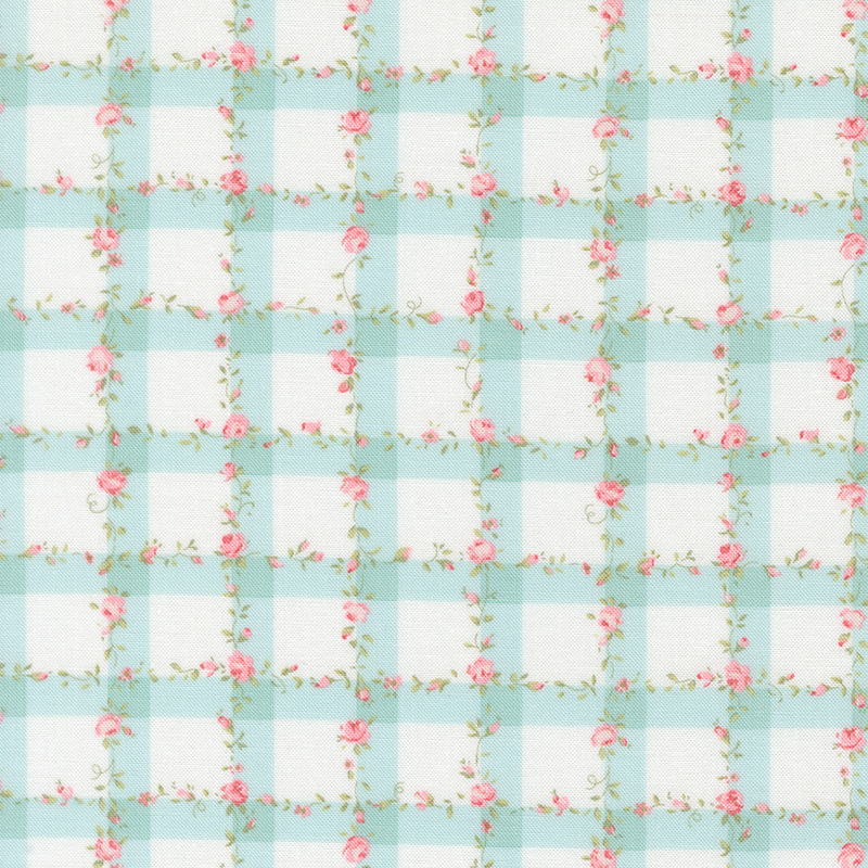 White fabric with a light blue gingham pattern scattered with pink roses and green leaves.