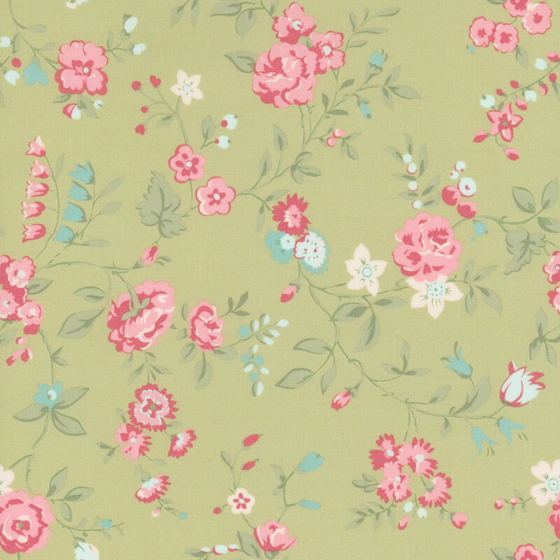 Green fabric with a pattern of large pink and blue florals alongside leaves.