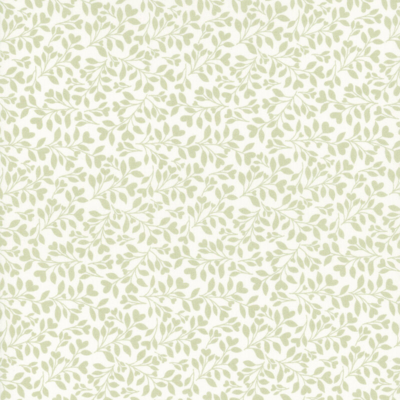 White fabric with a dense pattern of green leaves and vines accented with subtle hearts.