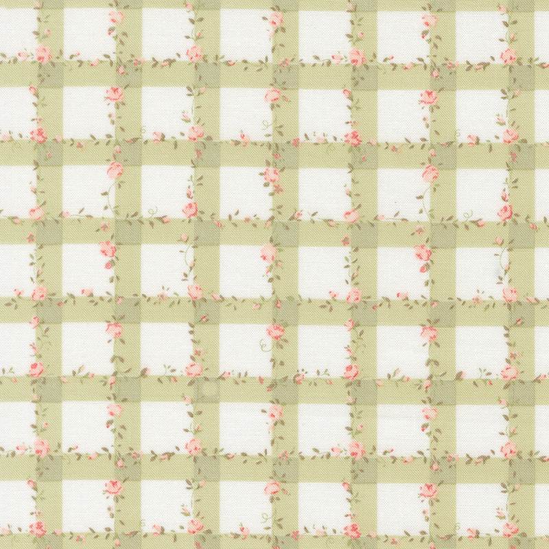 white fabric with a green gingham pattern scattered with pink roses and green leaves.