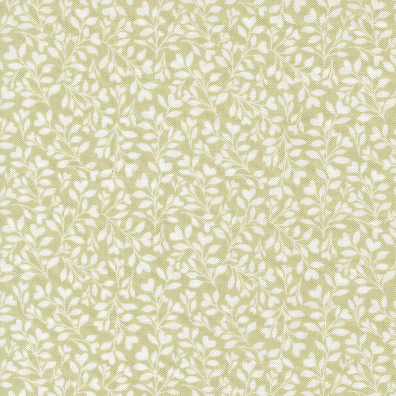 green fabric with a dense pattern of white leaves and vines accented with subtle hearts.