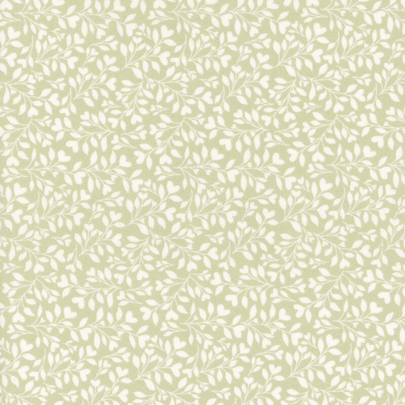 green fabric with a dense pattern of white leaves and vines accented with subtle hearts.