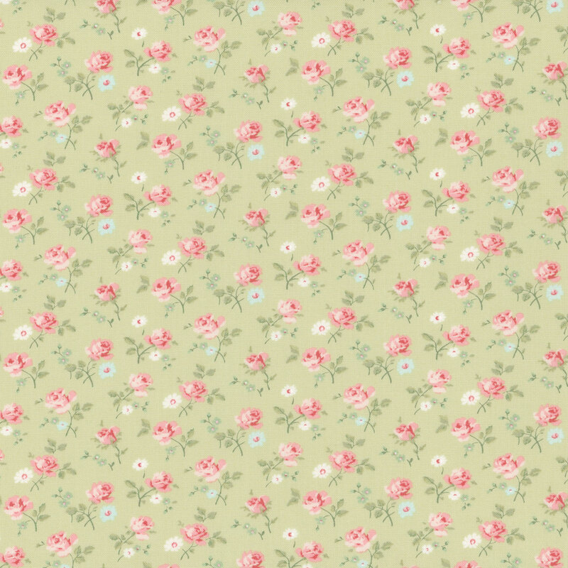 Green fabric with a dense pattern of tossed pink roses and assorted florals.