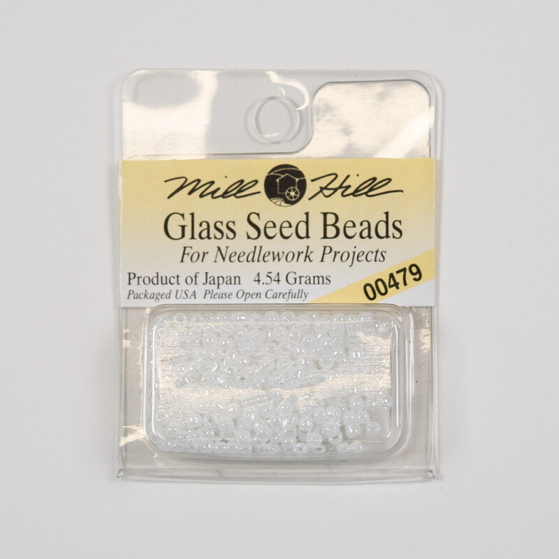 A package of Mill Hill Glass Seed Beads in the color white. 