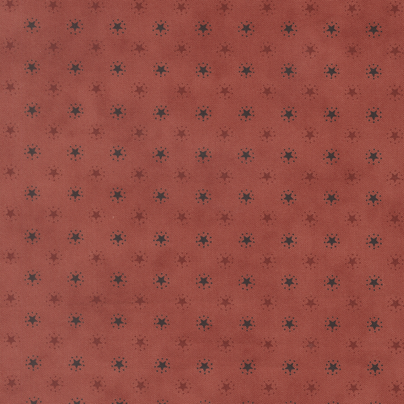 Scarlet fabric with an evenly spaced pattern of black and red stars.
