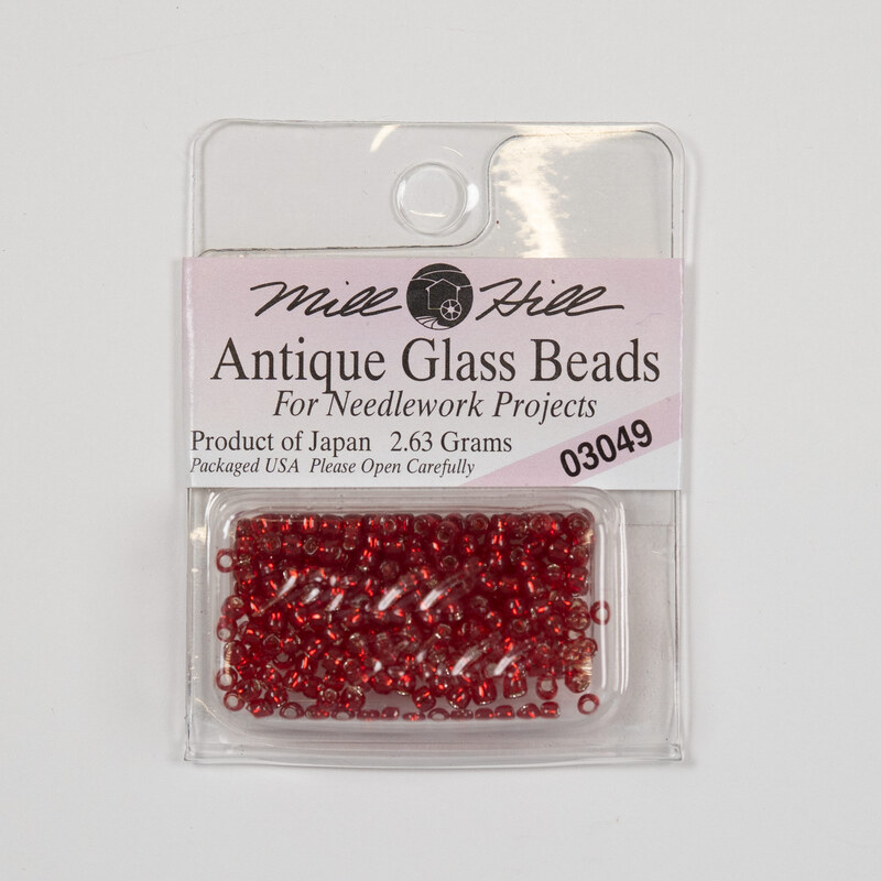 A package of Mill Hill Antique Seed Beads in the color rich red. 