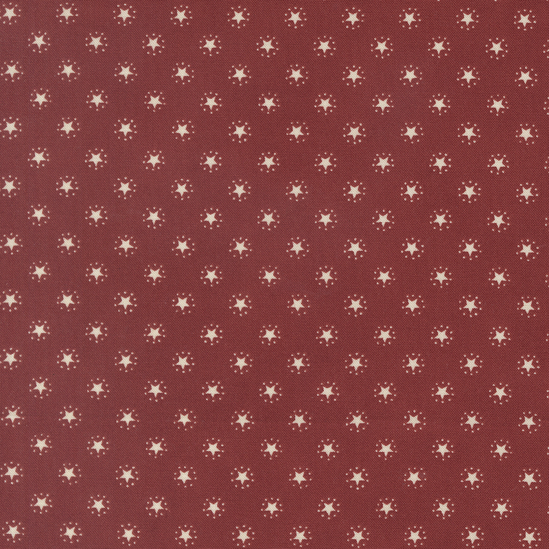 Crimson fabric with an evenly spaced pattern of white stars.