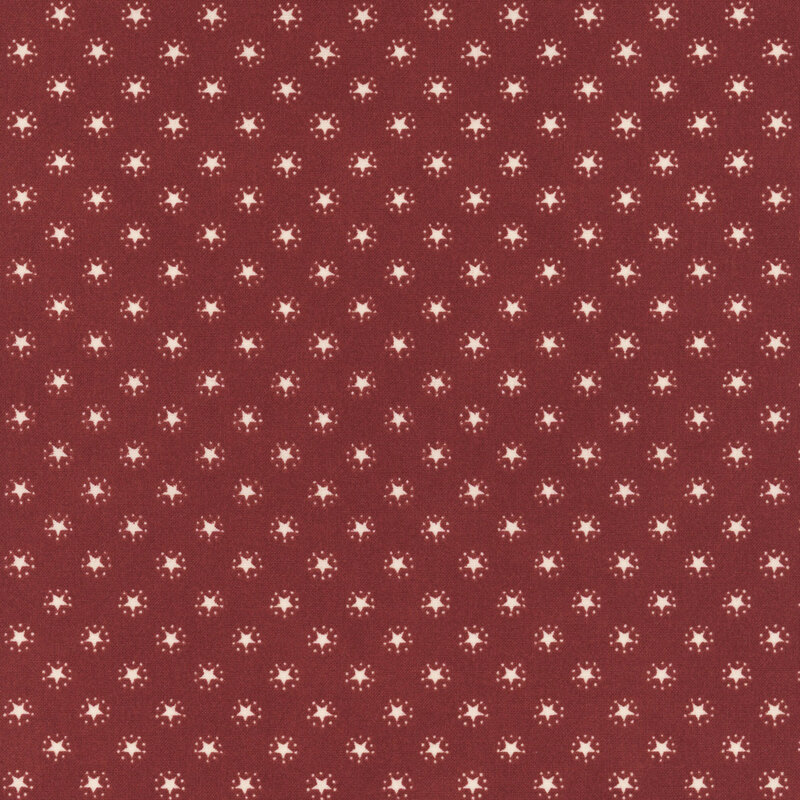 Crimson fabric with an evenly spaced pattern of white stars.