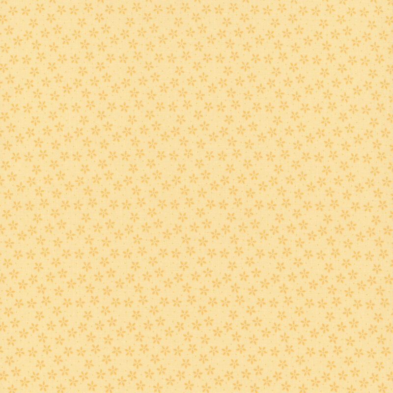 Sunshine yellow fabric with tiny tonal flowers crowded together amongst pinprick dots.