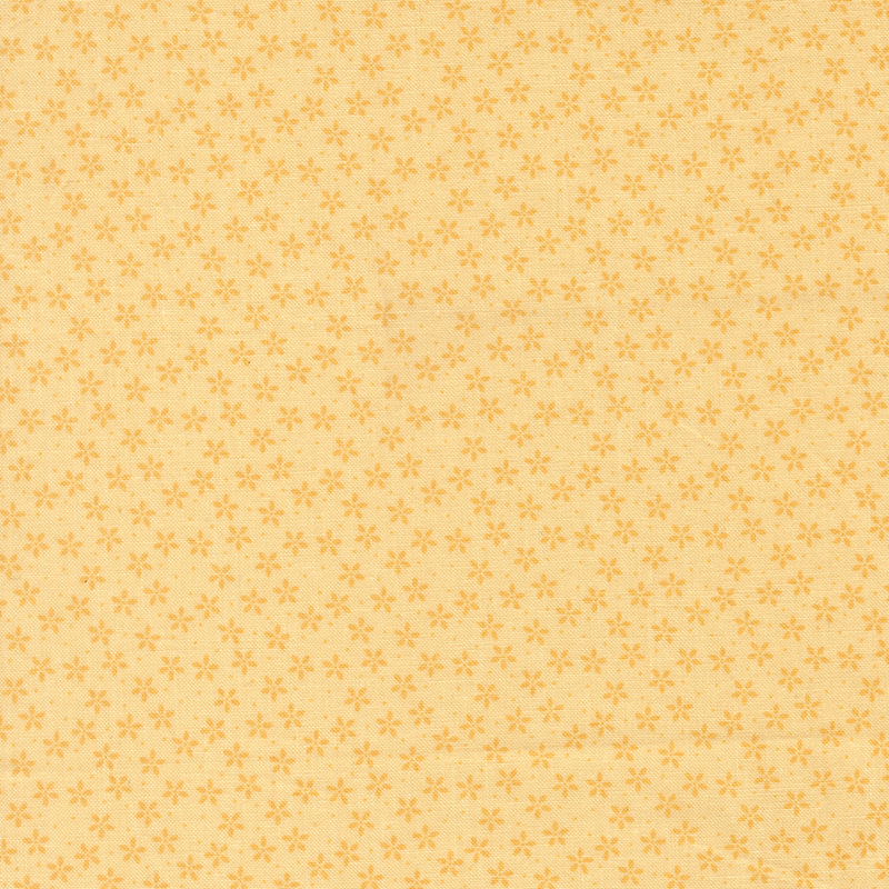 Sunshine yellow fabric with tiny tonal flowers crowded together amongst pinprick dots.