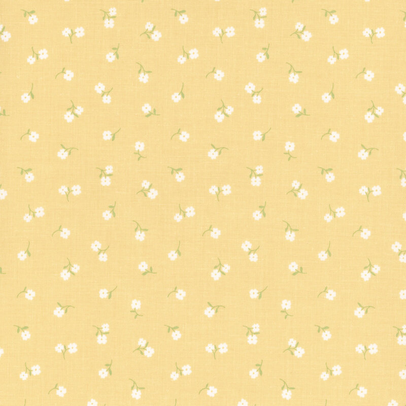 Yellow fabric with tossed white flowers.