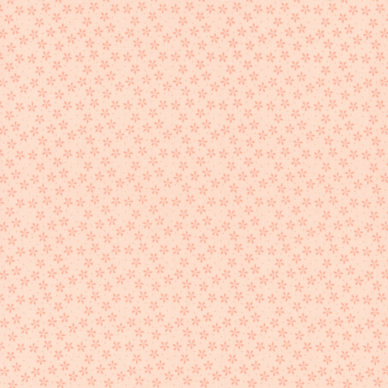 Coral pink fabric with tiny tonal flowers crowded together amongst pinprick dots.