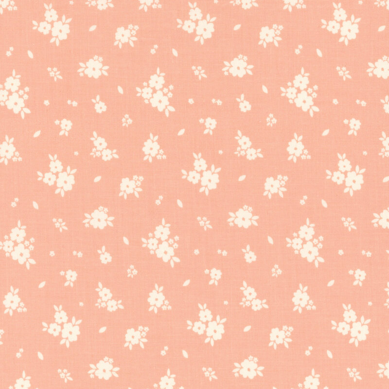 Bright coral fabric with tossed clusters of white flowers.