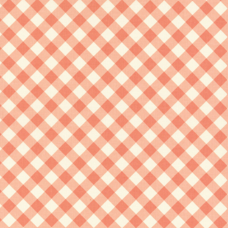 Fabric with a diagonal cream and coral gingham design.