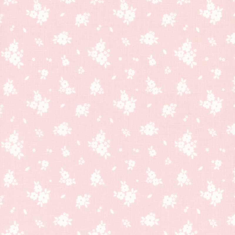 Light pink fabric with tossed clusters of white flowers.