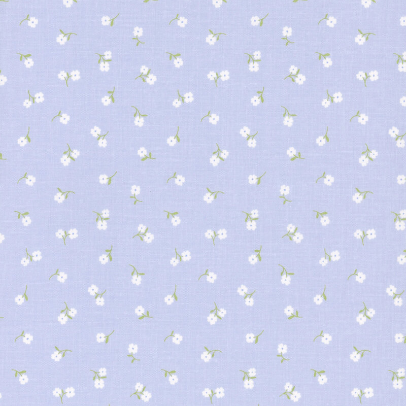 Pastel purplish-blue fabric with tossed white flowers.