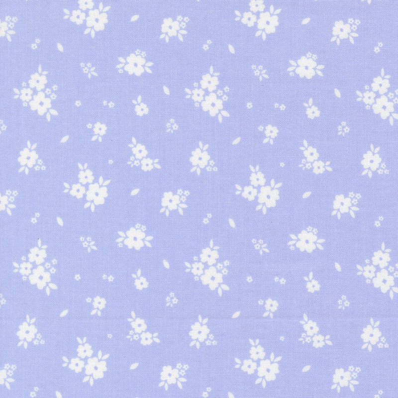 Bright purplish-blue fabric with tossed clusters of white flowers.