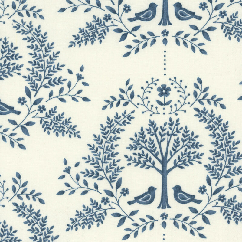 Cream fabric with a navy blue damask design featuring birds, trees, and leaves.
