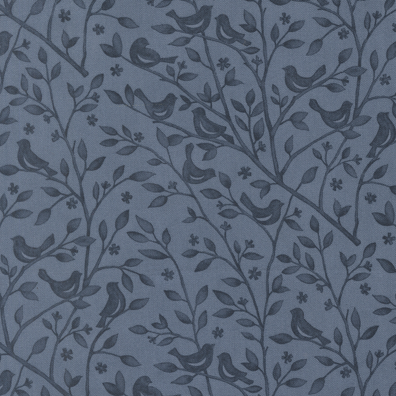 Cadet blue fabric swatch with a tonal pattern of leafy branches with birds perched atop them.