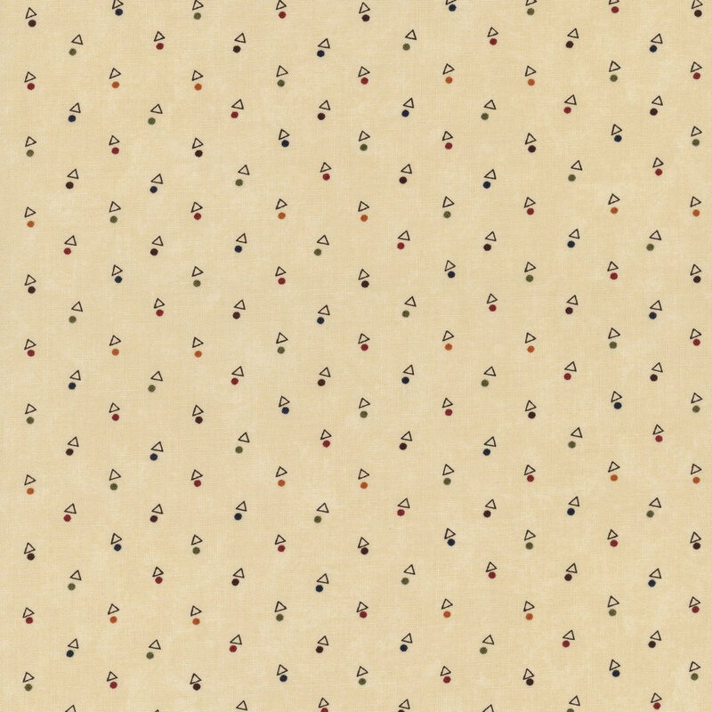 A mottled tan fabric with triangles and multicolored dots. 